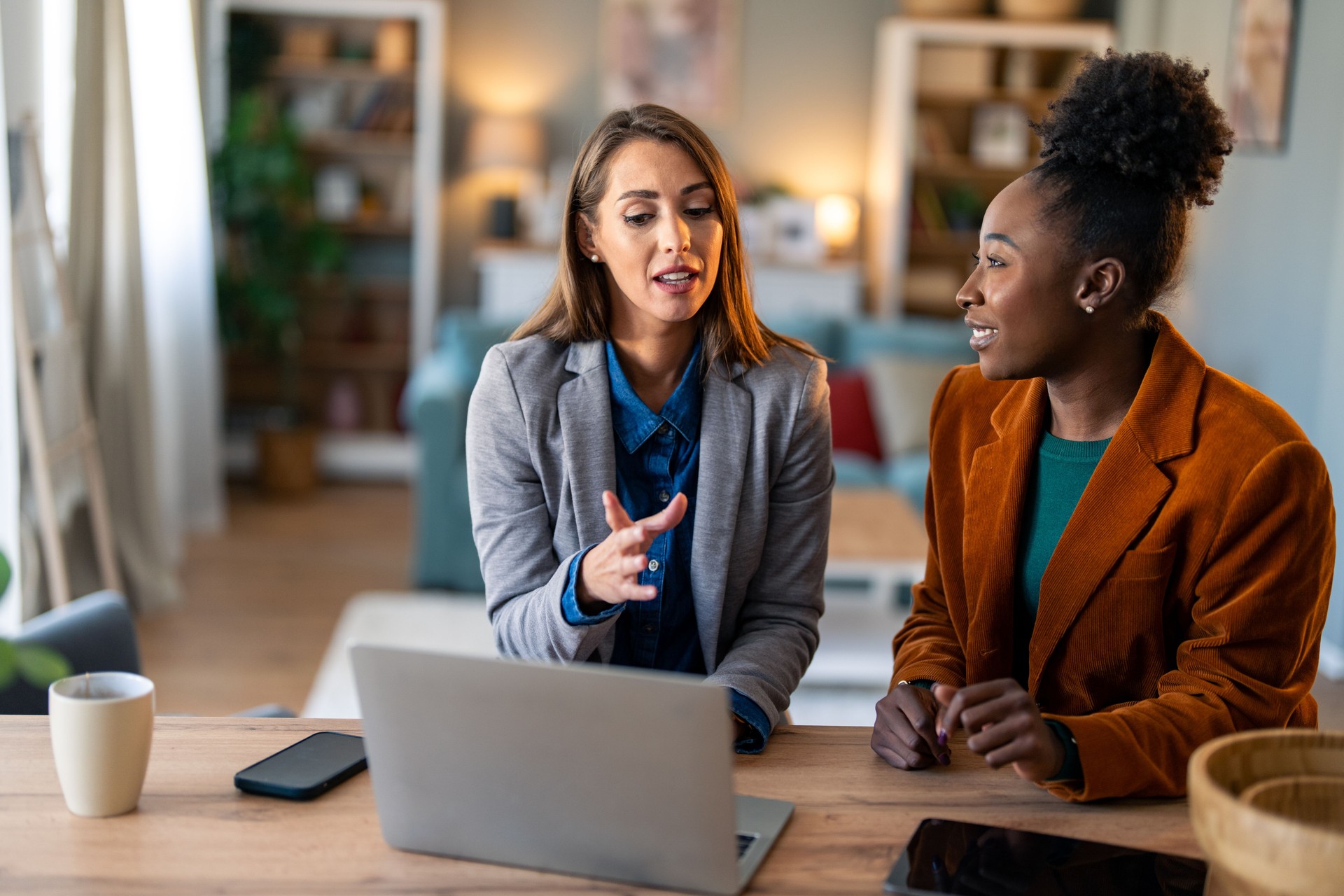 Professional Women Collaborating At Home Office Business Meeting
